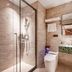 24k International Hotel People's Square in Shanghai bathroom with glass shower, vessel sink and mirror