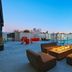 Aloft Waco Downtown rooftop terrace with fire pit seating and pool views in Waco