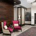 Hampton Inn Huntsville/Village of Providence lobby seating area with pink accent chairs and dining space