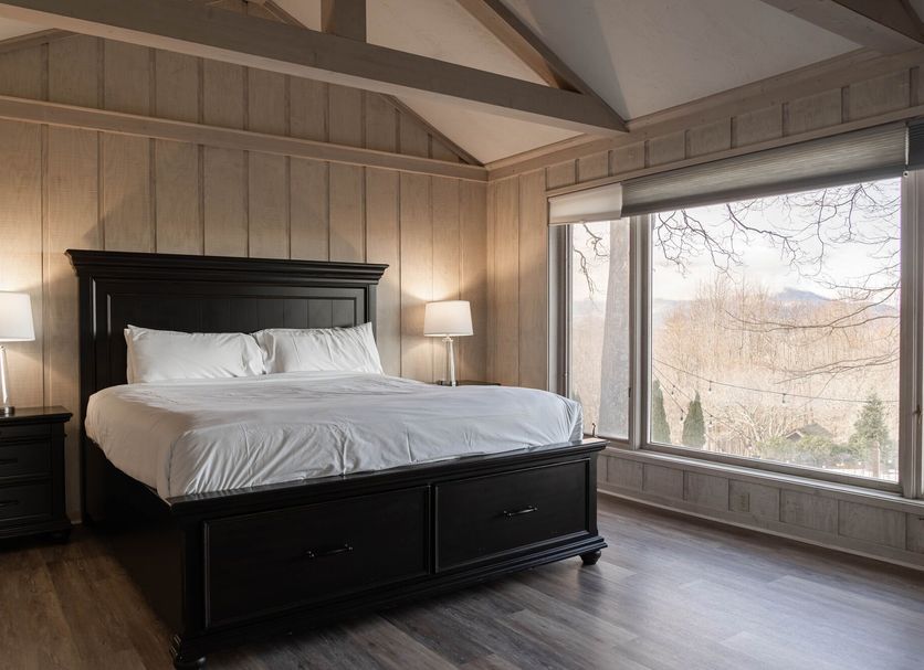 The Inn At Crestwood in Boone bedroom with king bed and large window view
