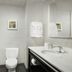 Hampton Inn & Suites El Paso-East bathroom with tub, toilet, sink, and wall mirror