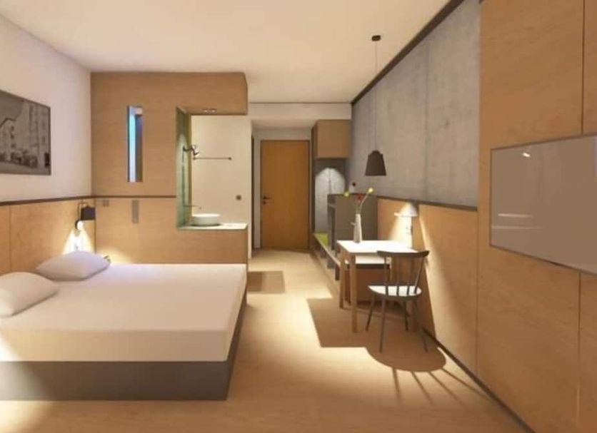 Gasthof-Hotel Höhensteiger guest room in Rosenheim with double bed, desk, and modern wood-accent decor