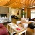 Reserva del Saja Hotel & Spa in Renedo de Cabuérniga lounge with stone fireplace and wood ceiling
