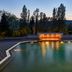Fonteverde Lifestyle & Thermal Retreat in San Casciano Dei Bagni, illuminated outdoor thermal pool at dusk