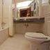 Majestic Oriental Hotel Siem Reap bathroom with bathtub, toilet, sink and mirror