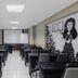 Citi Hotel Residence Caruaru meeting room with rows of black chairs and a projector screen in Caruaru