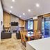 Eight Willows Retreat in Metricup: open-plan villa with dining area, fireplace, and sliding doors to garden