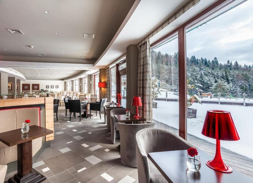 Hotel Spa Dr Irena Eris Krynica Zdrój lounge with large snowy mountain-view windows in Krynica-Zdrój