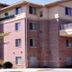 GrandStay Residential Suites Hotel Faribault exterior with brick facade and covered entrance