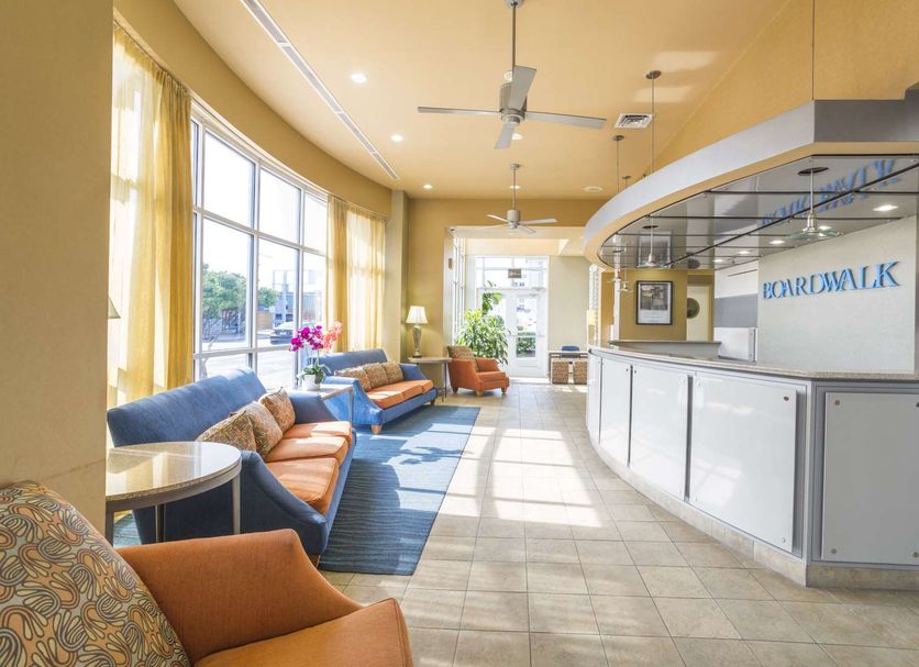 Boardwalk Resort and Villas Virginia Beach lobby with seating area and front desk
