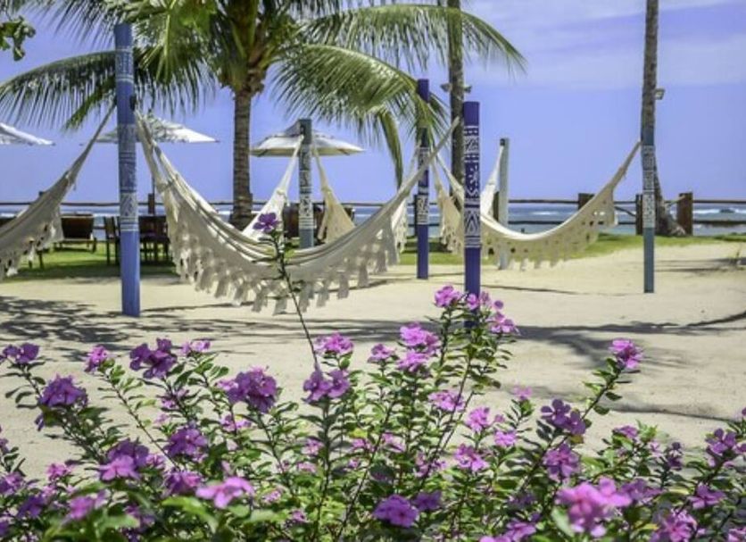 Villa dos Corais Pousada in Morro de Sao Paulo with hammocks, palm trees and oceanfront views