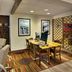 Four Points by Sheraton Nashville Airport business center with desk, computer, and chairs in Nashville