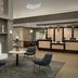 Homewood Suites by Hilton Alexandria/Pentagon South lobby with fireplace, seating area and front desk