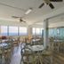 Peppertree by the Sea, North Myrtle Beach: bright ocean-view dining room with wicker chairs and tables