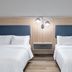 Candlewood Suites Houston (The Woodlands) By IHG guest room with two beds and wall-mounted reading lights