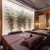 Xiang Ming Luxury Airport Hotel in Huangshan spa room with two massage tables and circular mirror
