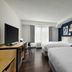 City Express by Marriott Washington, DC Northeast room with two beds, TV, desk and window view
