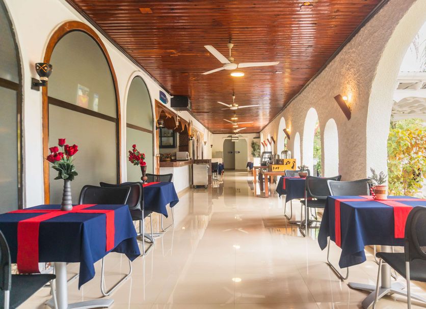 Best Western Jangwani Sea Breeze Hotel in Dar Es Salaam: airy arched terrace dining area with ocean view