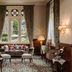 Ashdown Park Hotel & Country Club in East Grinstead lounge with stained-glass window and garden view