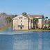 Fairfield Inn & Suites by Marriott St. Augustine I-95 by a lake with fountain spray and rainbow reflections