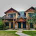 Ruttger's Bay Lake Resort in Deerwood, a lodge-style hotel with twin balconies and pine trees