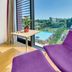 Hilton Garden Inn Venice Mestre San Giuliano room with floor-to-ceiling window overlooking pool and greenery in Venice