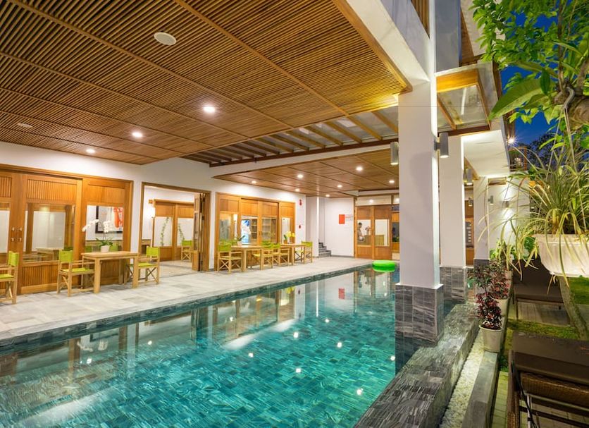 Zen Boutique Villa Hoi An in Hoi An with an indoor pool beside a covered seating area