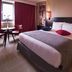 Hôtel Mercure Alger Aéroport guest room with queen bed, window seating area and modern decor in Algiers
