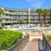 The Breakers Oceanfront 1 Bedroom Villas in Hilton Head Island with outdoor pool and palm trees