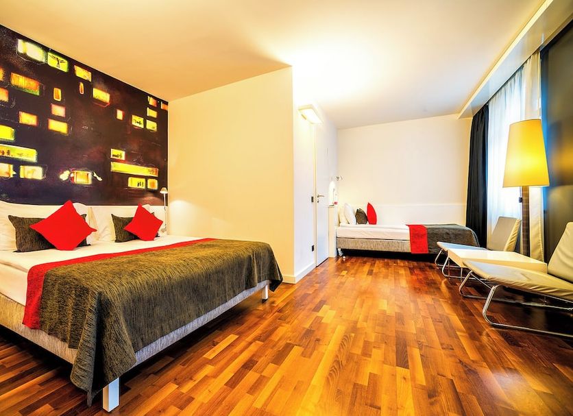 Bohem Art Hotel in Budapest guest room with two beds and a bright floor-to-ceiling window