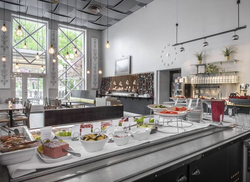 Quality Hotel Galaxen in Borlänge dining area with buffet breakfast spread and large windows