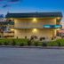 Motel 6 King City Ca exterior at dusk with illuminated entrance and free WiFi sign