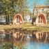 Downtown Forest Hostel & Camping in Vilnius: three pod cabins reflected in a pond under trees