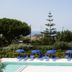 B&B Il Cavaliere in Santa Domenica with pool, blue loungers and umbrellas, plus distant sea view