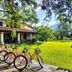 Hotel Villa Cantabria in Mascota with a row of bicycles on a lawn beside the hotel building