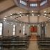 Kardinal Schulte Haus in Bergisch Gladbach chapel interior with benches and a circular hanging light fixture