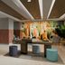 Hilton Garden Inn Mexico City Polanco lobby lounge with colorful mural, seating area and reception