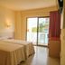 htop Molinos Park, Salou hotel room with twin beds and balcony sliding doors to a pool view
