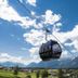 Hotel Geisler Tulfes in Tulfes with cable car over a mountain valley and cloudy sky