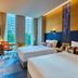 Aloft Seoul Gangnam guest room with two beds, desk, and city view in Seoul