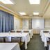 Monte Carlo Inn Oakville Suites meeting room in Oakville with table seating and projection screen