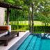 Muthi Maya Forest Pool Villa Resort in Pak Chong: private pool beside a lush garden and trees