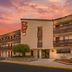 Red Roof Inn Tinton Falls-Jersey Shore exterior at sunset with balconies and parking lot in Tinton Falls