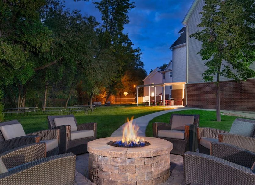 Residence Inn by Marriott Provo North fire pit seating area at dusk in Provo