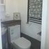Self Contained Rooms in Central Torquay bathroom with toilet, sink, towel rail and patterned towels