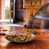 Pousada O Cantinho da Raposa in Monte Verde with a large woven chair and wooden table centerpiece