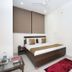 Oyo 8959 New Dk Palace Chandigarh guest room with double bed and window blinds
