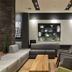 Melia Ibirapuera in Sao Paulo lounge with gray seating, wood coffee table and wall shelves