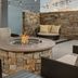 Residence Inn by Marriott Lubbock-University Area patio with stone fire pit and lounge seating in Lubbock