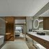 DoubleTree by Hilton Weihai bathroom with freestanding tub, double vanity and bedroom view toward the sea